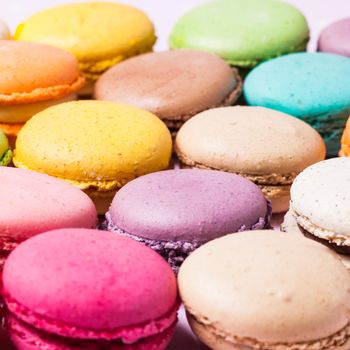 Colorful macaroons - french dessert as a background