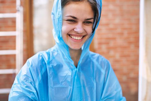 woman paints wood painter repair protective suit. High quality photo
