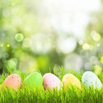 Easter greetings with grass and eggs with copy space