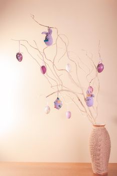 Handmade easter decorations on the branches in vase