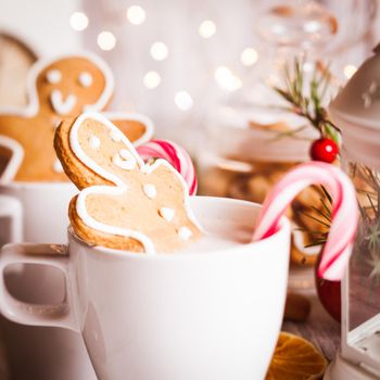 Cup of hot cocoa drink with cookie and candy. Christmas dessert