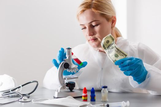 Woman working with a microscope in lab