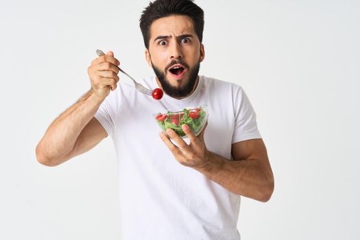 bearded man plate with vegetable salad eating health. High quality photo