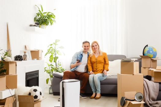 family with an air purifier moving to a new apartment
