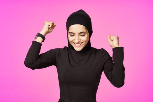 funny muslim clock technology posing pink background. High quality photo