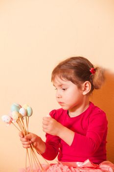 Girl is doing an Easter handmade decorations for holiday