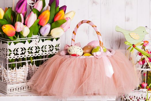 Easter decorations - spring flowers and eggs in tutu basket