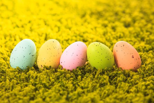 Easter eggs on the grass carpet, holiday decorations