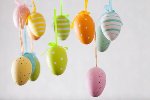 Easter wreath with color eggs on ribbons