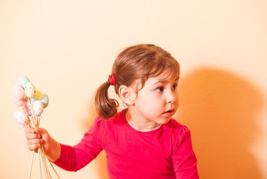 Girl is doing an Easter handmade decorations for holiday