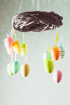 Easter wreath with color eggs on ribbons