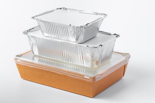Assortment of food delivery containers on white background close up