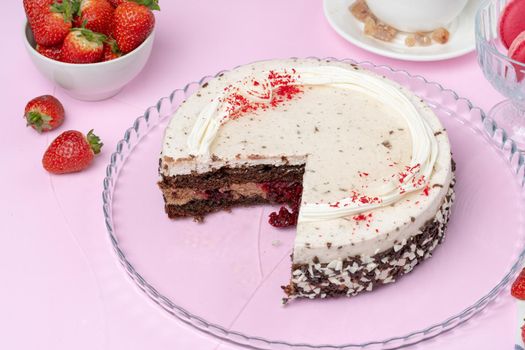 Chocolate cake with whipped cream icing on plate. High quality photo