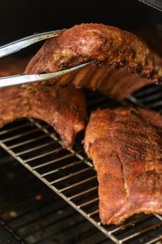 Beef Ribs Cooking on Barbecue Grill. Backyard BBQ party concept