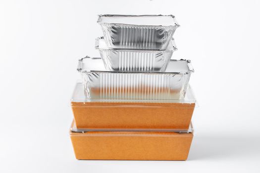 Assortment of food delivery containers on white background close up