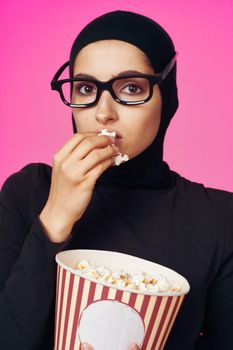 cheerful woman attractive look popcorn glasses movie watching purple background. High quality photo