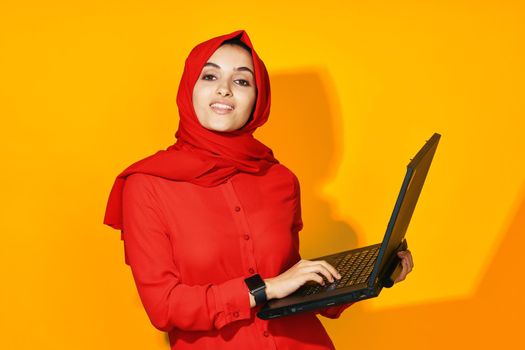 Muslim with laptop in hands technology emotions ethnicity model. High quality photo
