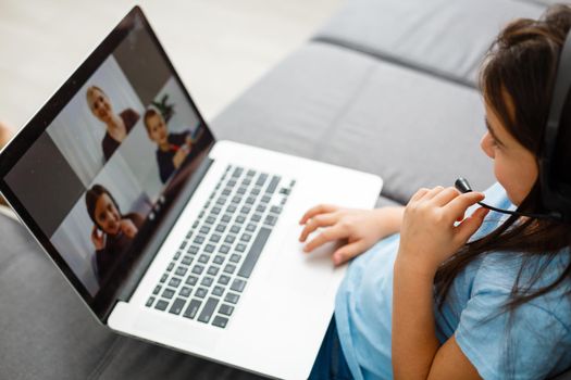 Little girl studying homework math during her online lesson at home, social distance during quarantine, self-isolation Copy space Banner