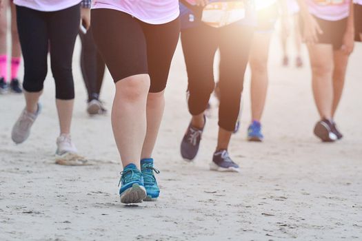 Marathon Running In The Light Of Evening, Healthy Group Of People Jogging On Tracking Road, Fitness Running To Lose Weight.