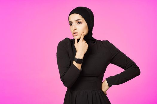 funny muslim clock technology posing pink background. High quality photo