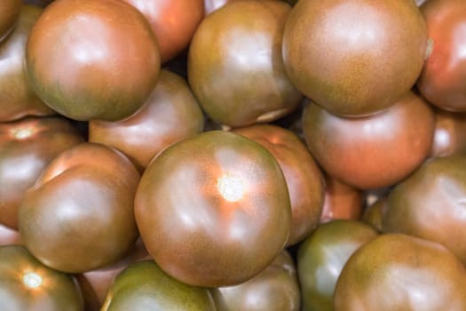 ripe brown tomatoes close-up as a background. High quality photo
