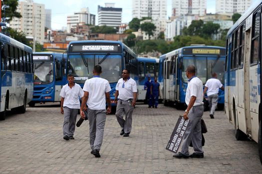 salvador, bahia, brazil - april 4, 2019: Bus driver are seen in during gravel movement in a company garage in the city of Salvador.