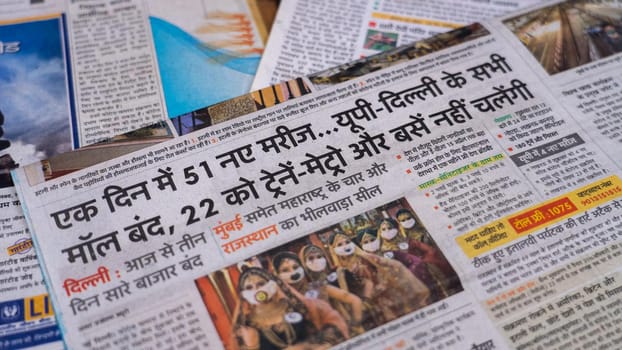 Dehradun, Uttarakhand India June 28, 2021. Hindi, Coronavirus COVID-19 News Headline in Newspaper of India. Headlines of the month March, April 2020.