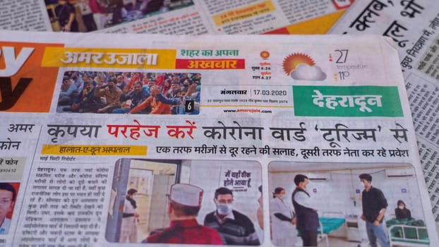 Dehradun, Uttarakhand India June 28, 2021. Hindi, Coronavirus COVID-19 News Headline in Newspaper of India. Headlines of the month March, April 2020.