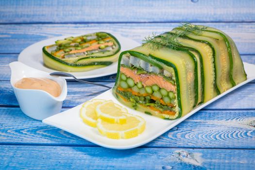 Recipe of marbled vegetables, salmon and langoustines, terrine salmon vegetables and langoustines. High quality photo