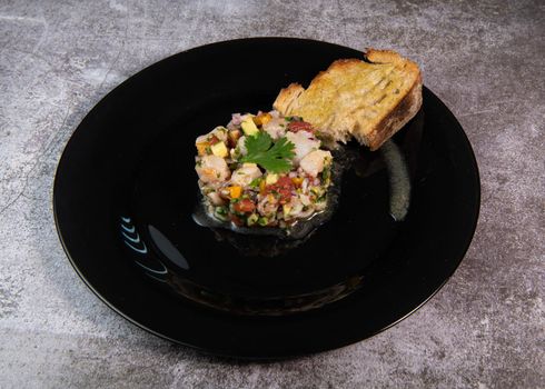 Cod Ceviche recipe, bread in oil and garlic. High quality photo