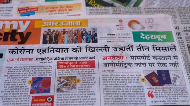 Dehradun, Uttarakhand India June 28, 2021. Hindi, Coronavirus COVID-19 News Headline in Newspaper of India. Headlines of the month March, April 2020.