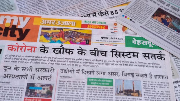 Dehradun, Uttarakhand India June 28, 2021. Hindi, Coronavirus COVID-19 News Headline in Newspaper of India. Headlines of the month March, April 2020.