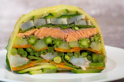 Recipe of marbled vegetables, salmon and langoustines, terrine salmon vegetables and langoustines. High quality photo