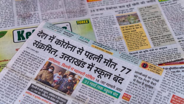 Dehradun, Uttarakhand India June 28, 2021. Hindi, Coronavirus COVID-19 News Headline in Newspaper of India. Headlines of the month March, April 2020.