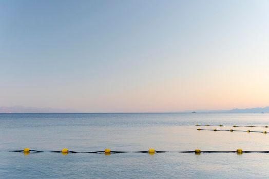 Sunset over the Red sea with pink orange mountains on the background. Eilat, Aqaba, Israel, Jordan . High quality photo