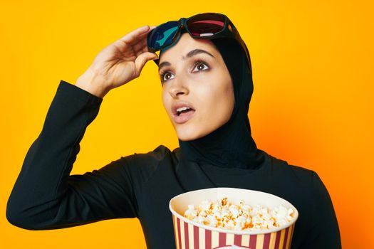 cheerful woman 3D glasses entertainment emotions yellow background. High quality photo