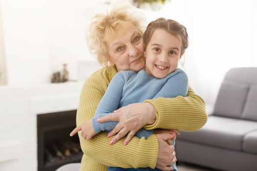 Grandmother and granddaughter portrait, embraced