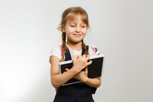 little girl using tablet computer. Isolated on white background.