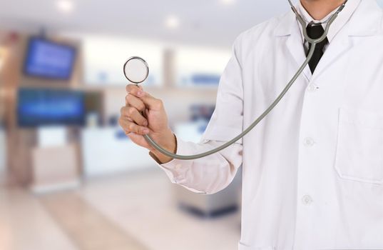 doctor with stethoscope in hospital background