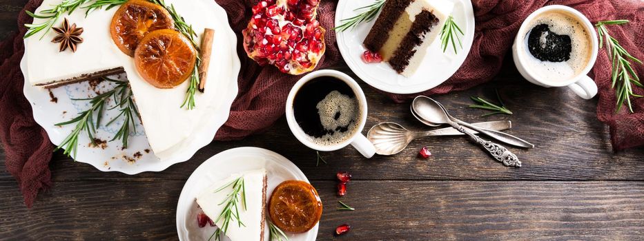 Pieces of delicious chocolate cake with orange jam covered with cheese cream. Christmas dinner concept. Selective focus. Top view. Copy space.