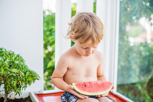 Boy smiling and eating watermelon. Childhood concept. Healthy food concept