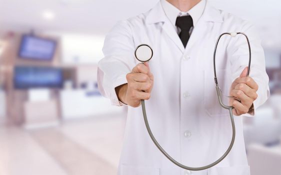 doctor with stethoscope in hospital background