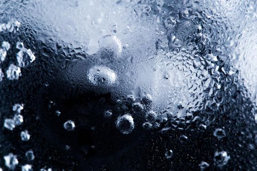 ice and water in a glass cup - closeup