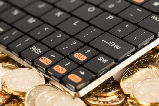 many coins and kebroad on a white background for financal contents