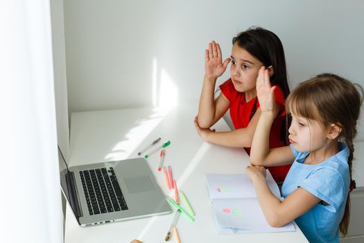 Learning from home, Home school kid concept. Little children study online learning from home with laptop. Quarantine and Social distancing concept.