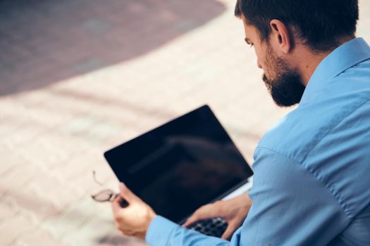 man with tablet working on the street. High quality photo