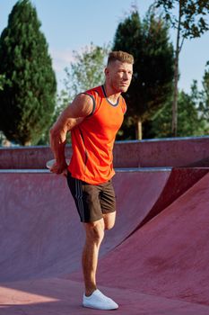 man doing exercises outdoors in the park. High quality photo