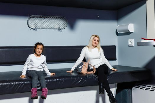 Ukraine, Kiev - February 2, 2020: Interior of exhibition ukraine wow. mother and daughter on the big train seat.