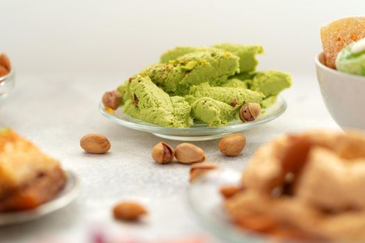 Close up photo of colorful Turkish halva sweets on gray surface