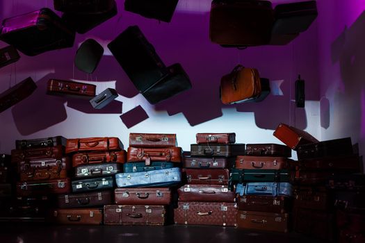 Pile of colorful vintage suitcases